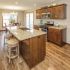 Cozy custom design kitchen with island and bar stools for casual dining and family time