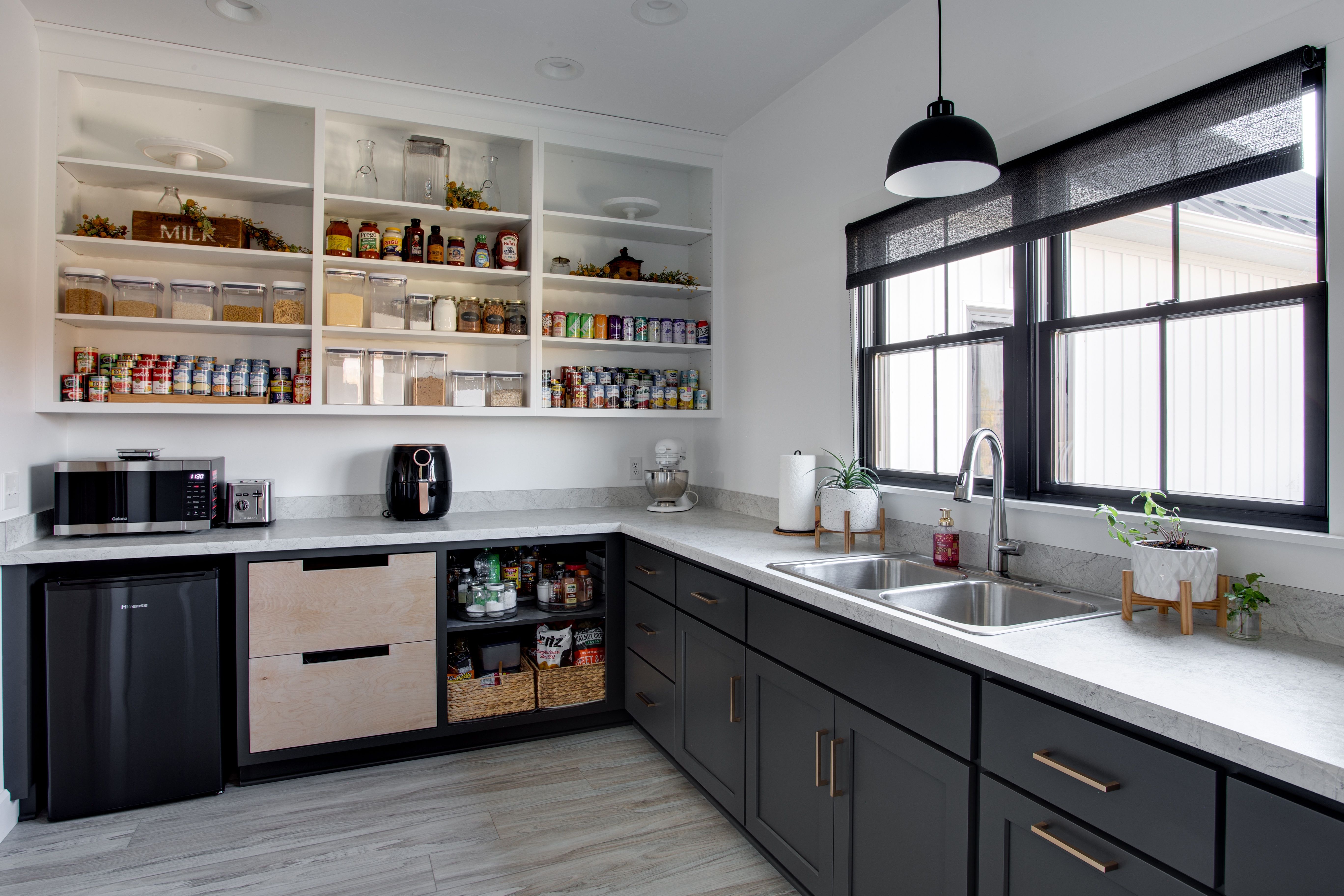 Cozy custom design kitchen with island and bar stools for casual dining and family time