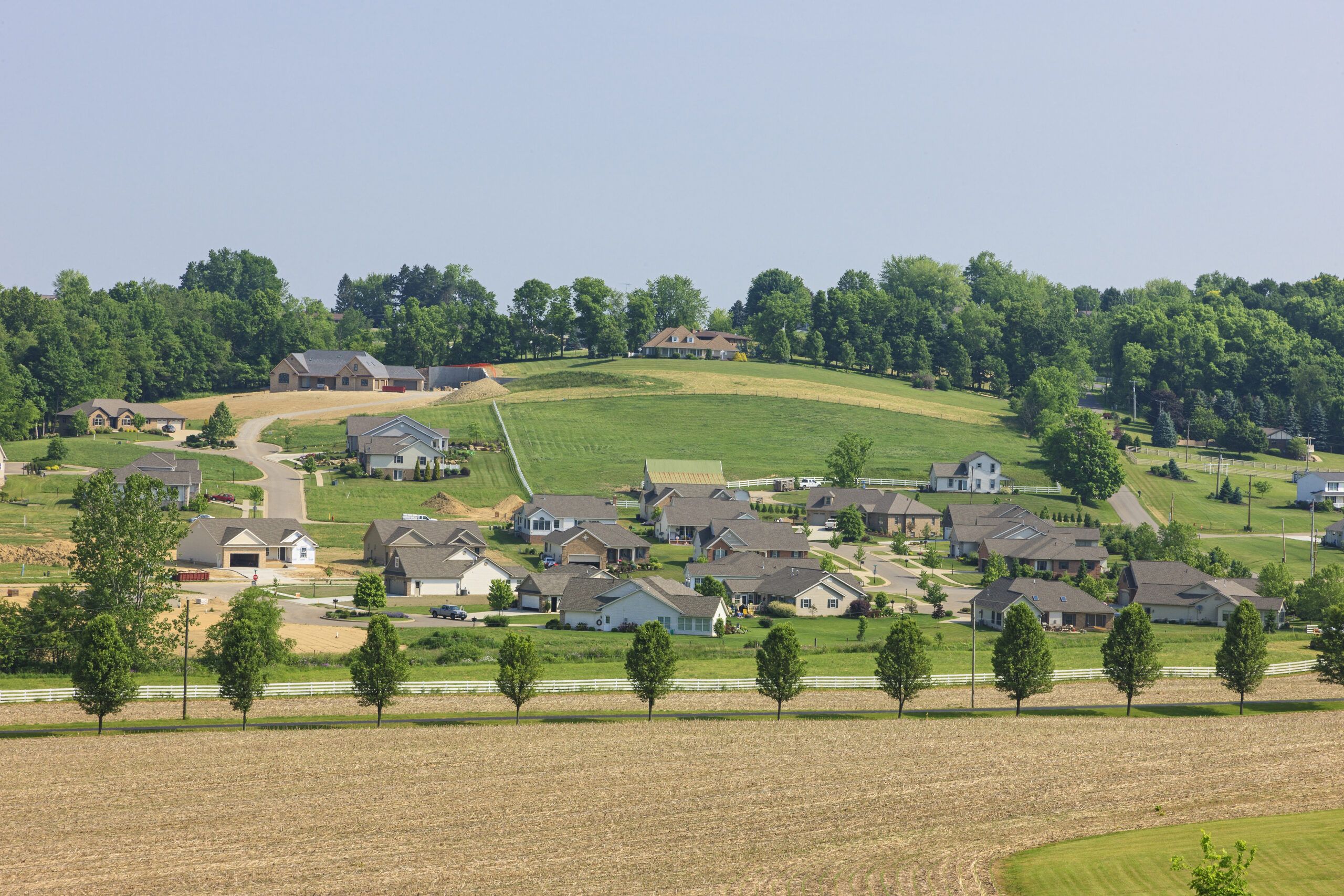 Hillside view of custom built homes in the country